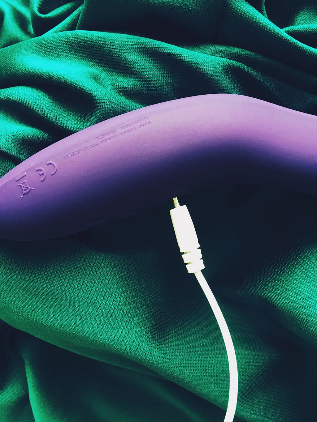 Photo of purple we-vibe rave vibrator showing charging cable being plugged in