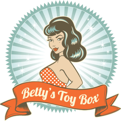 Logo for Bettys Toy Box shows pin-up style cartoon woman behind orange ribbon banner that reads Betty's Toy Box on blue starburst background